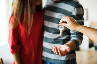 A Couple being handed keys